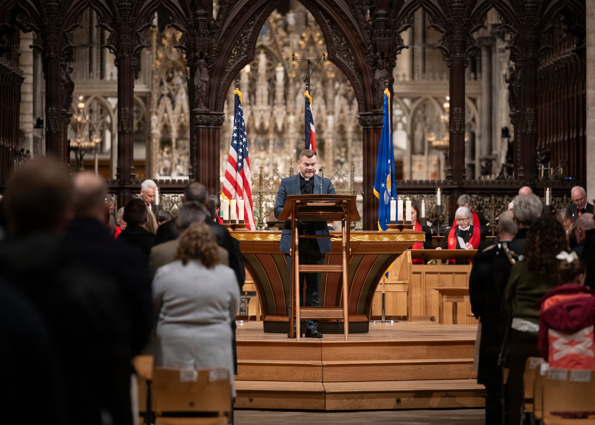 Revd David Young, RAF Honington chaplain, leads a prayer at Ely Cathedral, Nov. 26, 2025. Ely Cathedral has partnered with the tribase area for the past 39 years to host a traditional service for U.S. service members during the Thanksgiving holiday. (U.S. Air Force photo by Staff Sgt. Nash Truitt)