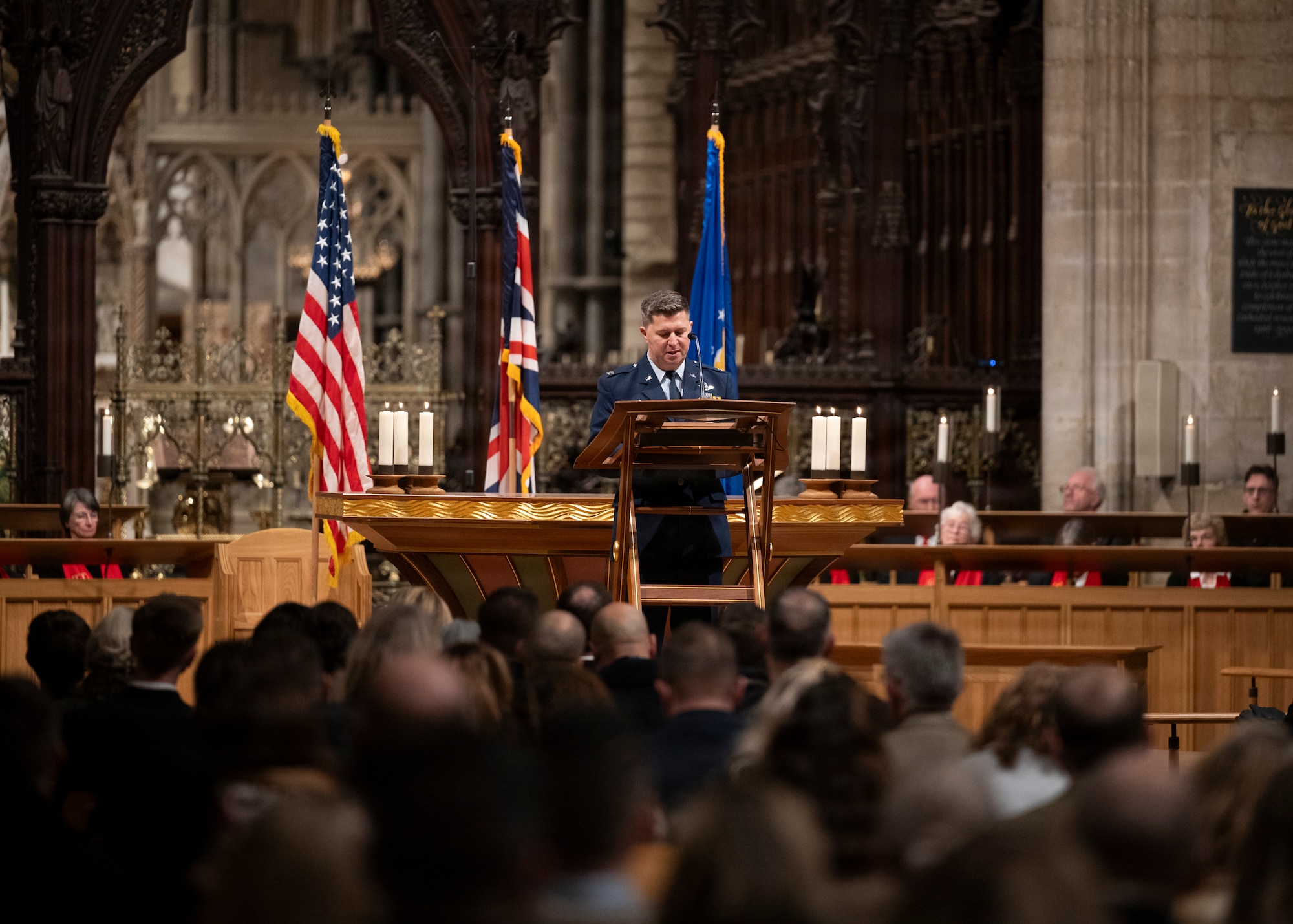 Col. Steven Byrum, 100th Air Refueling Wing commander, speaks to the gathered assembly at Ely Cathedral, Nov. 26, 2025. Ely Cathedral has partnered with the tribase area for the past 39 years to host a traditional service for U.S. service members during the Thanksgiving holiday. (U.S. Air Force photo by Staff Sgt. Nash Truitt)