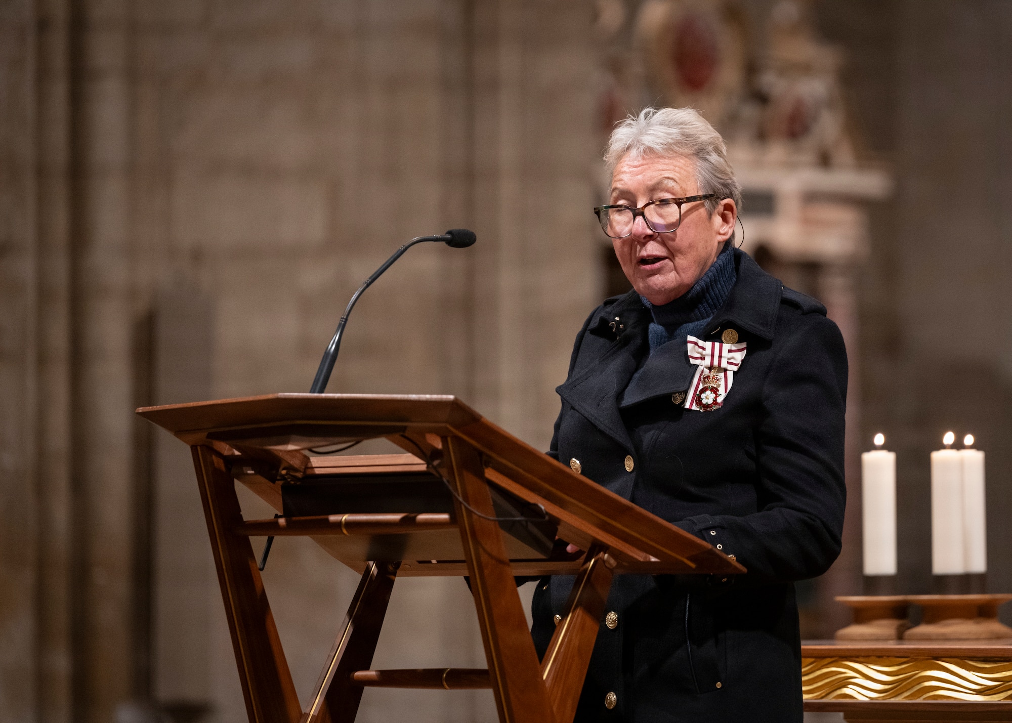 His Majesty's Lord Lieutenant of Cambridgeshire, Julie Spence OBE CStJ QPM, speaks to the gathered assembly at Ely Cathedral, Nov. 26, 2025. Ely Cathedral has partnered with the tribase area for the past 39 years to host a traditional service for U.S. service members during the Thanksgiving holiday. (U.S. Air Force photo by Staff Sgt. Nash Truitt)