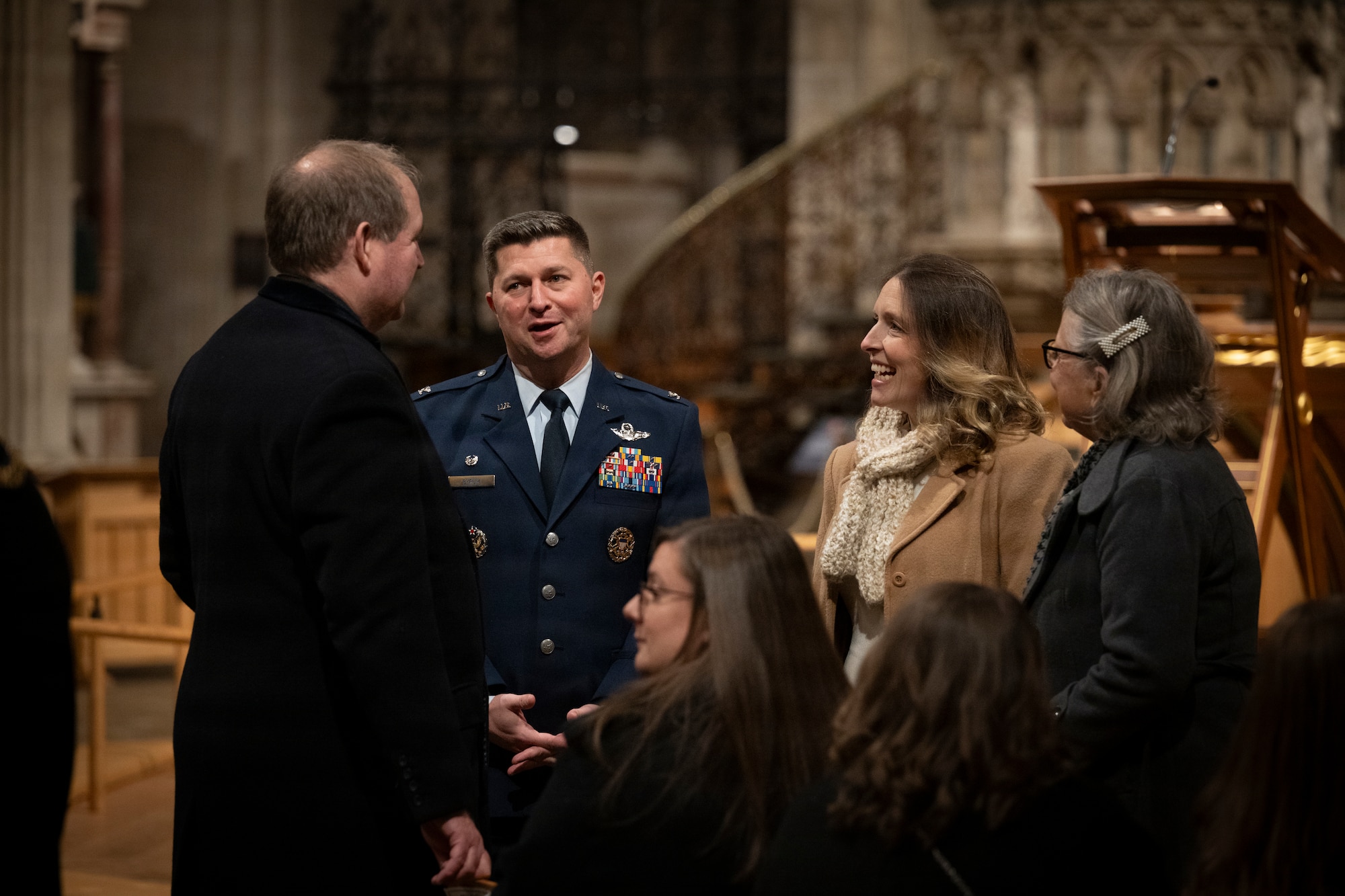 Col. Steven Byrum, 100th Air Refueling Wing commander, speaks with Christopher Walkingshaw D.L., RAF Lakenheath, RAF Mildenhall British American committee chairman at Ely Cathedral, Nov. 26, 2025. British and American nationals attended a Thanksgiving service held for U.S. service members stationed in the U.K. (U.S. Air Force photo by Staff Sgt. Nash Truitt)