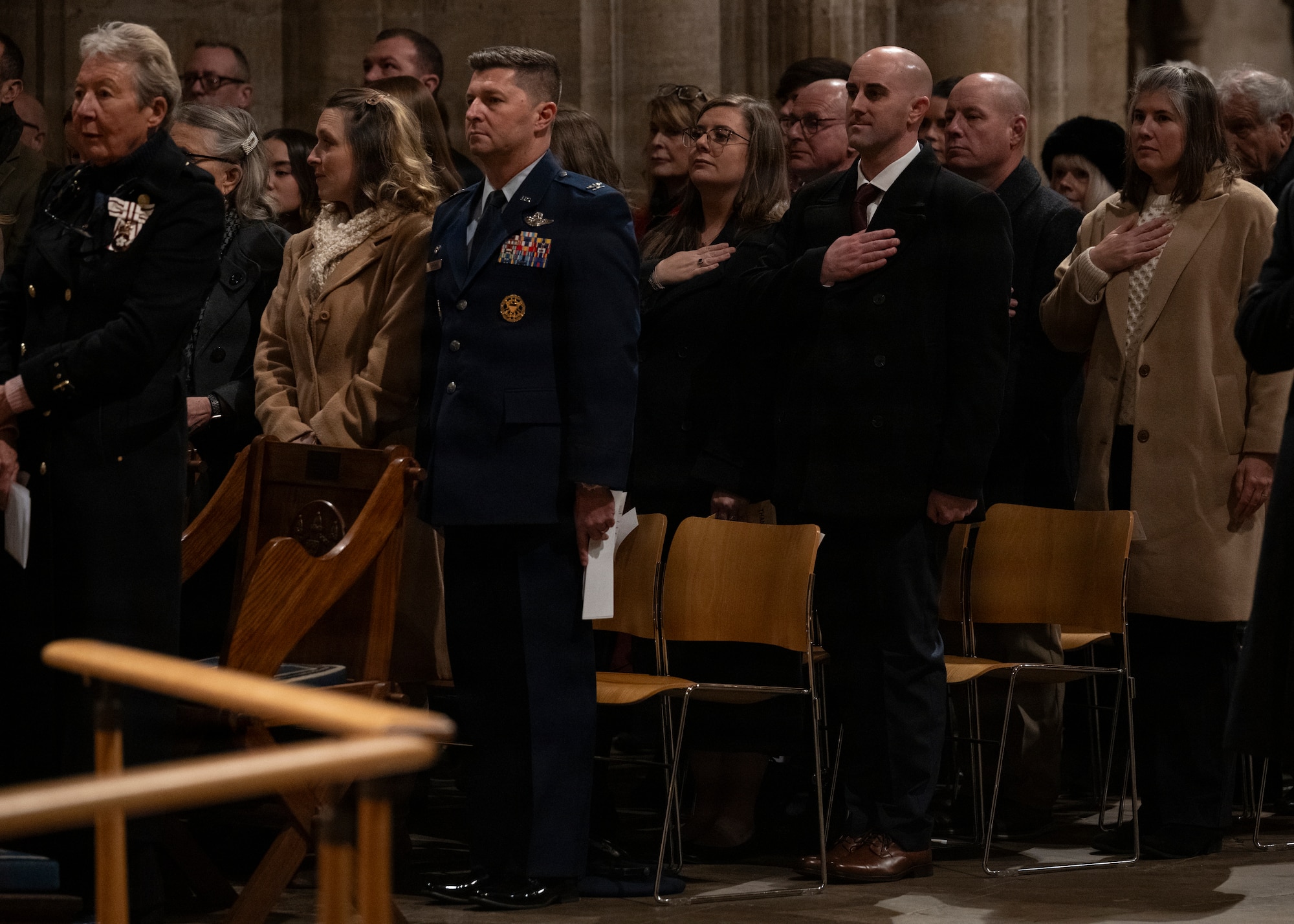 American and British guests stand for the playing of The Star-Spangled Banner at Ely Cathedral, Nov. 26, 2025. British and American nationals attended a Thanksgiving service held for U.S. service members stationed in the U.K. (U.S. Air Force photo by Staff Sgt. Nash Truitt)