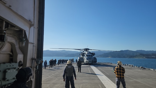 Explosive Ordnance Disposal Mobile Unit (EODMU) 5  Expeditionary Mine Countermeasures (ExMCM) Company 9-3 and Japan Maritime Self-Defense Force (JMSDF) EOD teams board an MH-53E Sea Dragon from Helicopter Mine countermeasures squadron 15 (HM-15) to conduct helicopter casting training during Mine Warfare Exercise (MINEX) 3JA near Aburatsu, Japan, Nov. 22, 2025.