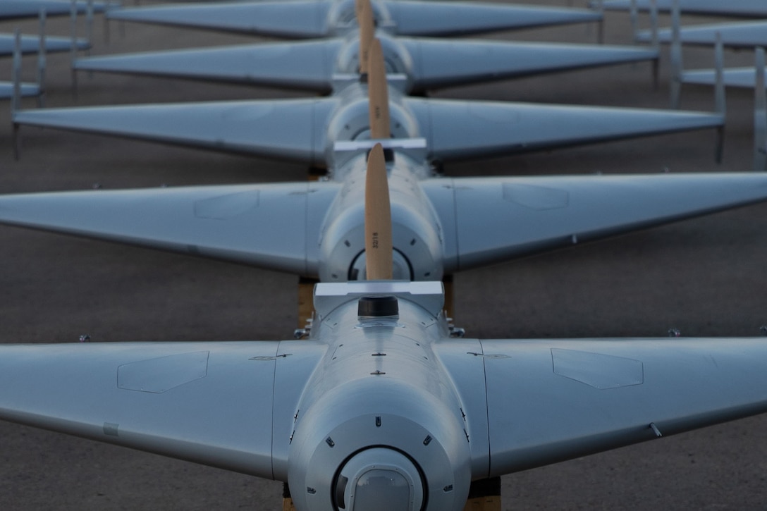 U.S. CENTRAL COMMAND AREA OF RESPONSIBILITY (Nov. 23, 2025) Low-cost Unmanned Combat Attack System (LUCAS) drones are positioned on the tarmac at a base in the U.S. Central Command (CENTCOM) operating area, Nov. 23. The LUCAS platforms are part of a one-way attack drone squadron CENTCOM recently deployed to the Middle East to strengthen regional security and deterrence. (Courtesy Photo)