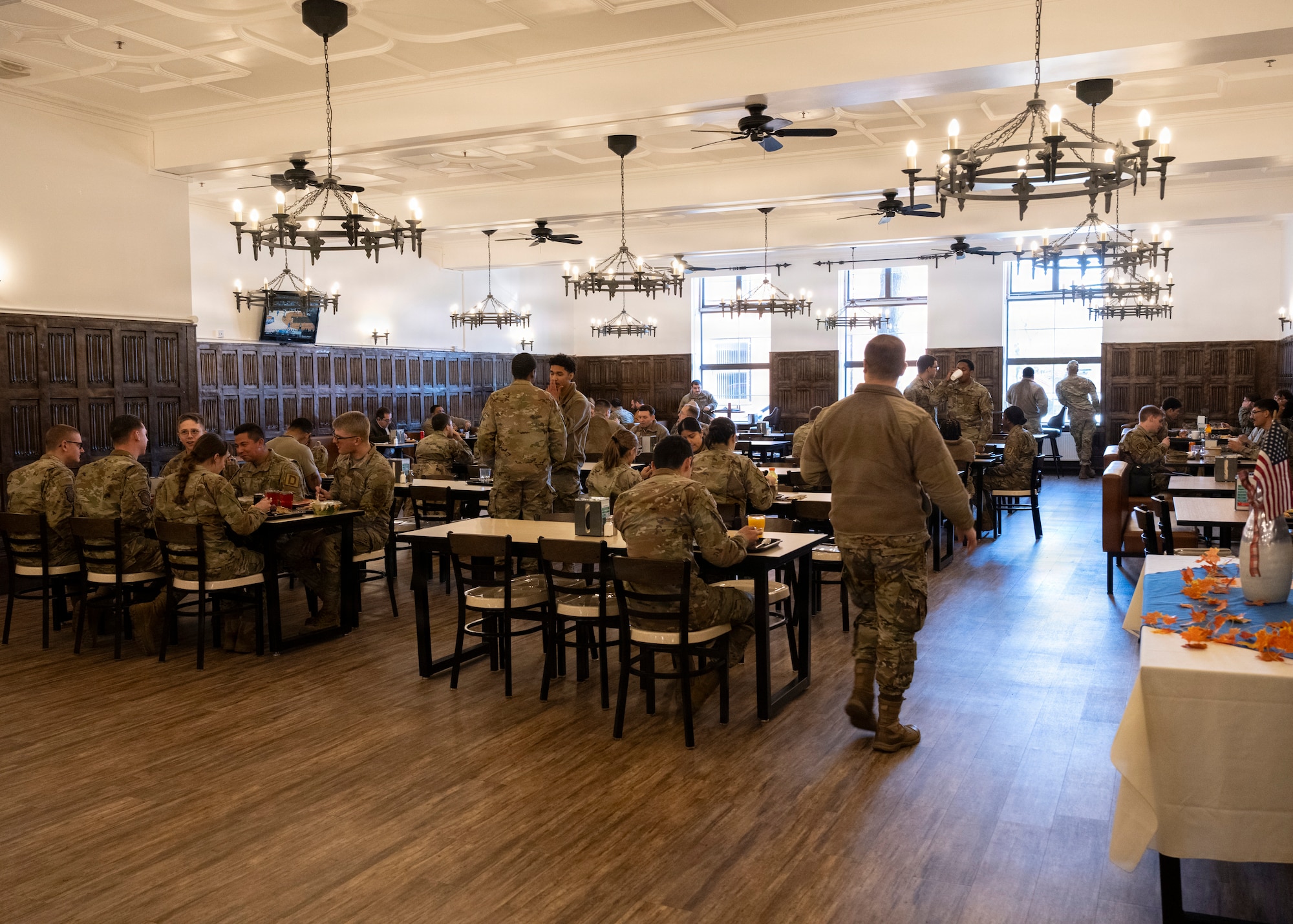 U.S. Air Force service members enjoy a Thanksgiving lunch served by base leadership at RAF Mildenhall, Nov. 26, 2025. The 100th Force Support Squadron and base leadership prepared and served meals to Airmen who are stationed away from home this holiday season. (U.S. Air Force photo by Staff Sgt. Nash Truitt)