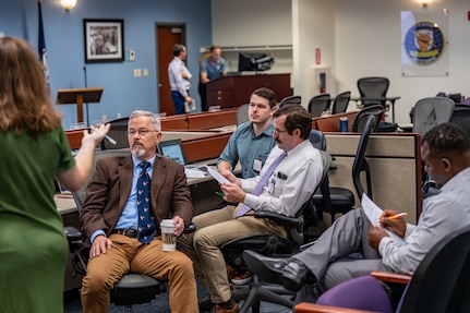 DAHLGREN, Va. – The Naval Surface Warfare Center Dahlgren Division team collaborated for six hours at Kitty Hawk Technologies during the International Mission Engineering Hackathon to complete their challenge. (U.S. Navy Photo by Dorina Watermolen)