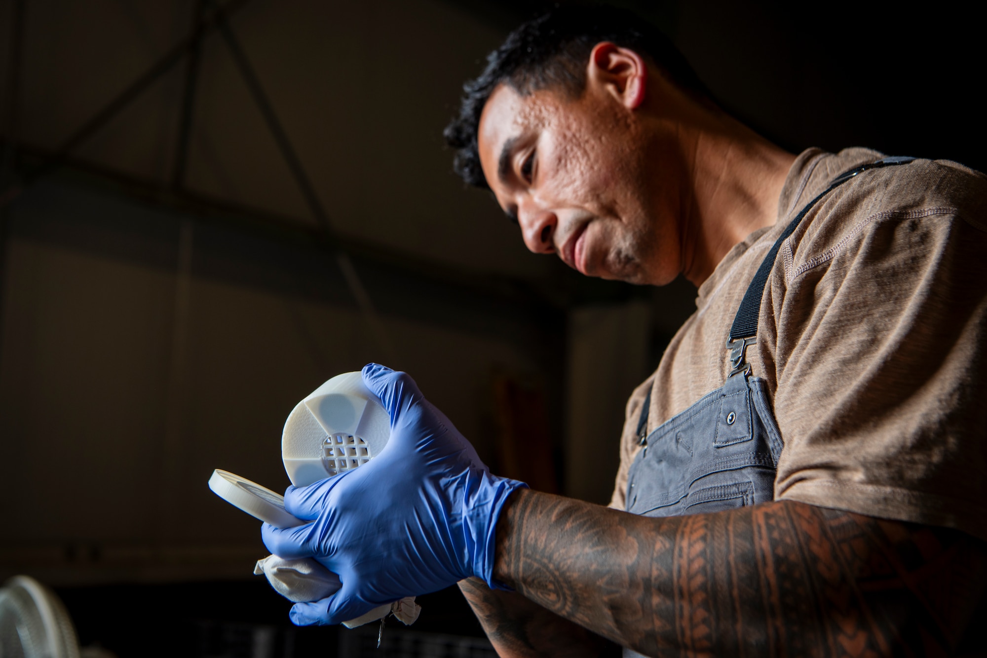 U.S Air Force Staff Sgt. Edwin Argueta-Hernandez, 436th Security Forces Squadron military working dog trainer, places a tin of narcotics into a Narcotics Printed Protection Enclosure (NPPE) at Dover Air Force Base, Oct. 15, 2025. The NPPE has been in development for a little over a year and was designed by the Joint Military Working Dog Laboratory within the Forensic Toxicology department of the Armed Forces Medical Examiner System on Dover AFB. These casings were developed to not only offer greater protection but to expand training possibilities for MWD handlers. (U.S. Air Force photo by Staff Sgt. Noah D. Coger)