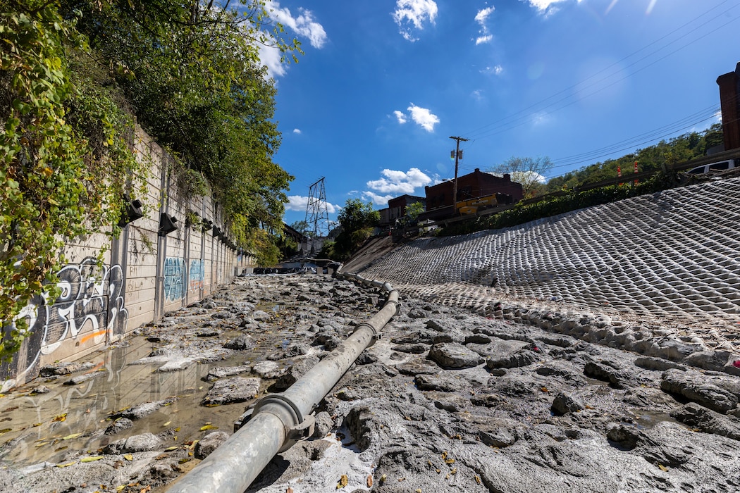 A wide view of a dewatered flood-protection project.