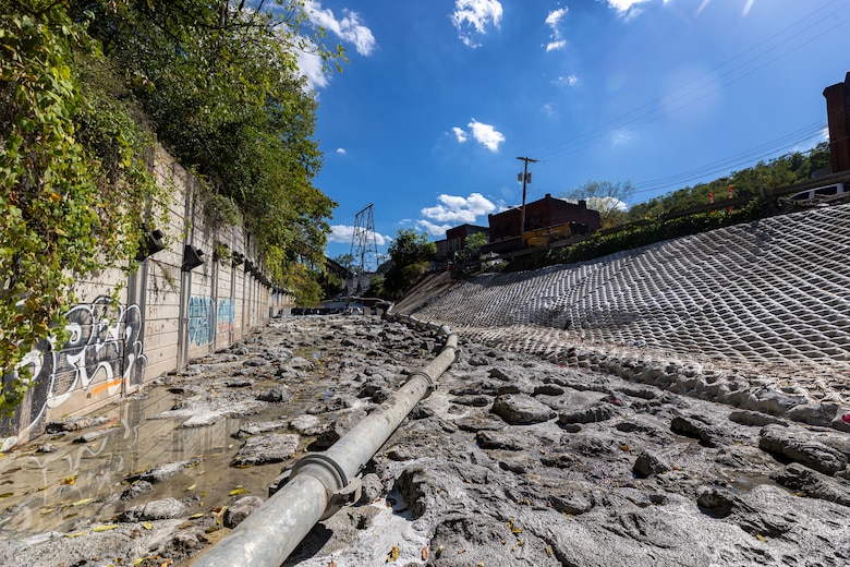 A wide view of a dewatered flood-protection project.