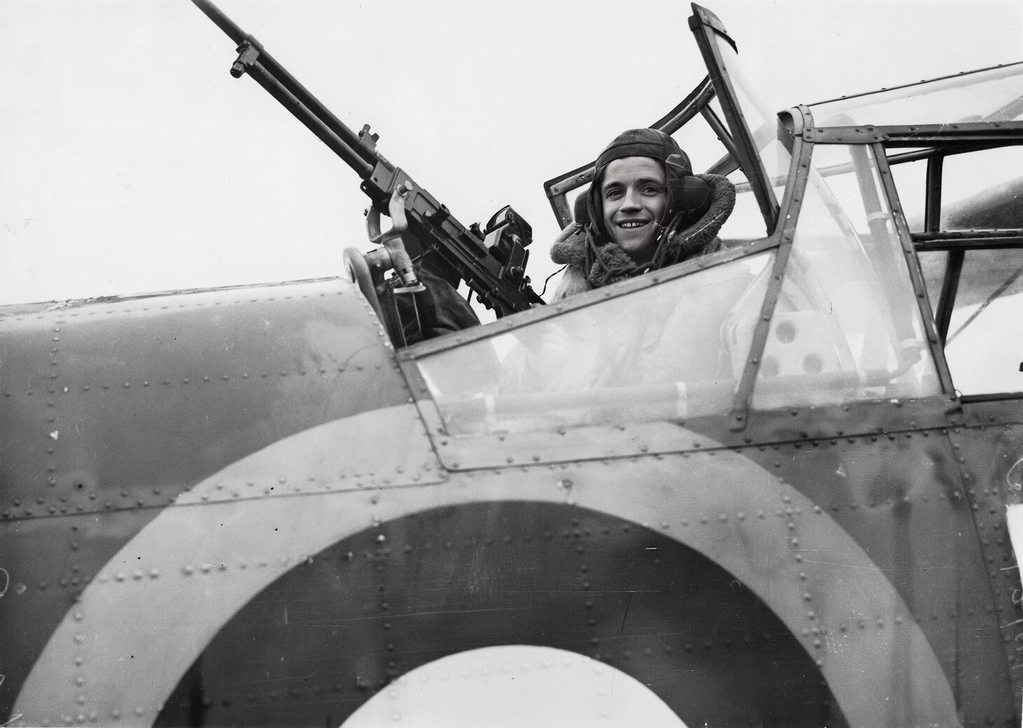 Exhibiting the exuberance and confidence of a young sailor at war is this rear air gunner of a Fairey Albacore.