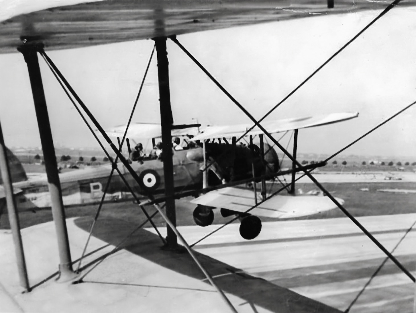 A rare photo shows a 834 Naval Air Squadron Swordfish and its crew take off from Floyd Bennett Field with another Swordfish crew in New York in August 1942.