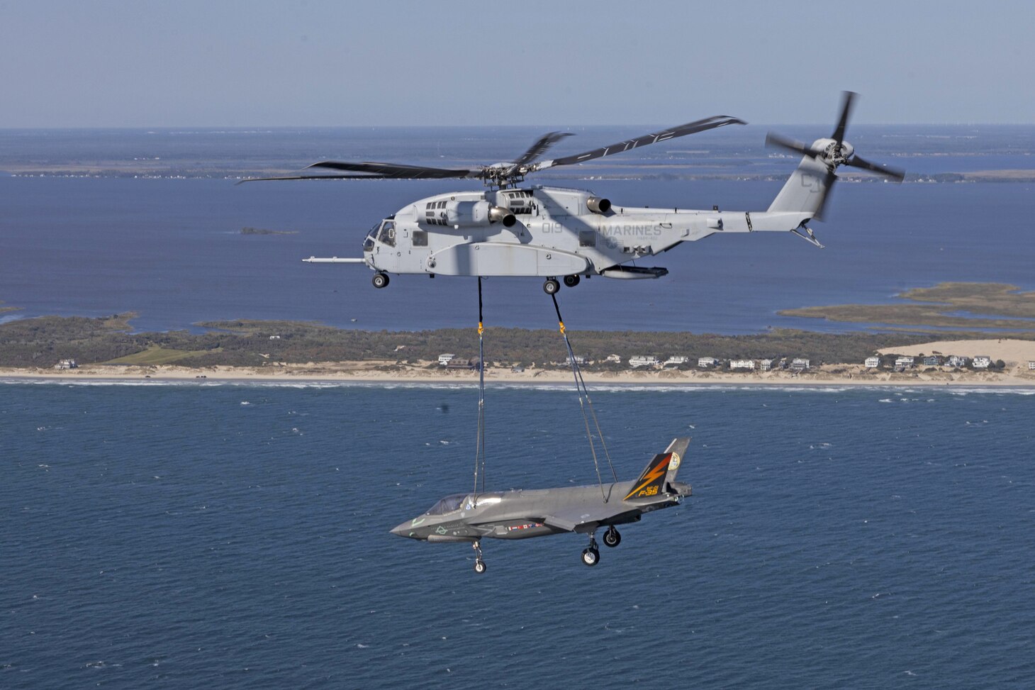 U.S. Marines with Marine Heavy Helicopter Squadron (HMH) 461, Marine Aircraft Group 29, 2nd Marine Aircraft Wing (MAW), transport an F-35B Lightning II near Naval Air Station Patuxent River, Maryland, Aug. 27. The F-35, known as BF-1, was the first F-35 to perform a vertical landing and was transported to Marine Corps Air Station Beaufort, South Carolina, for use as a permanent static display.