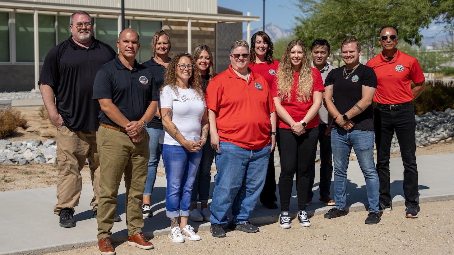Members of Naval Air Warfare Center Weapons Division’s Aircrew Electronic Warfare Tactical Training Ranges Integrated Product Team gather for a group photo after completing the Type V harness project.