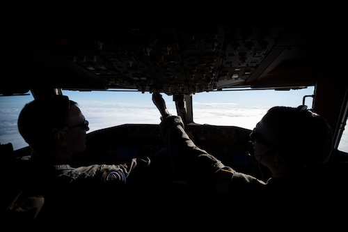 From left, U.S. Air Force Gen. Johnny Lamontagne, Air Mobility Command commander, and Capt. Dustin Raab, 9th Aerial Refueling Squadron KC-46A Pegasus instructor pilot, fly the 100th U.S. Air Force KC-46A during its initial delivery to Travis Air Force Base, California, Dec. 2, 2025. Lt. Gen. John Healy, chief of the Air Force Reserve and the commander of Air Force Reserve Command, flew the 99th KC-46A in formation alongside Lamontagne. (U.S. Air Force photo by Staff Sgt. Dalton Williams)