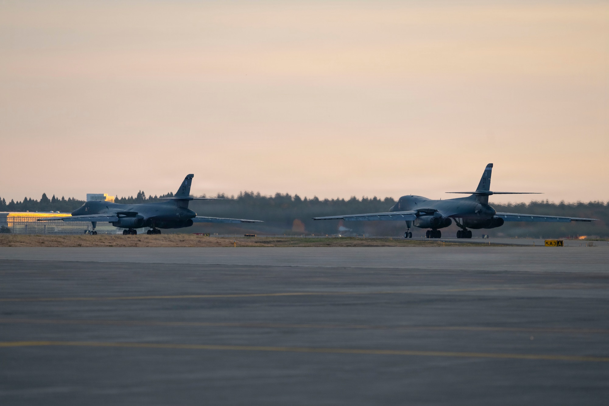 U.S. Air Force B-1B Lancers taxi for takeoff to return to Dyess Air Force Base, Texas, at Misawa Air Base, Japan, Nov. 17, 2025, concluding a bomber task force deployment. Bomber task force deployments support the shared vision of a secure, free and prosperous Indo-Pacific region. (U.S. Air Force photo by Senior Airman Emma Anderson)