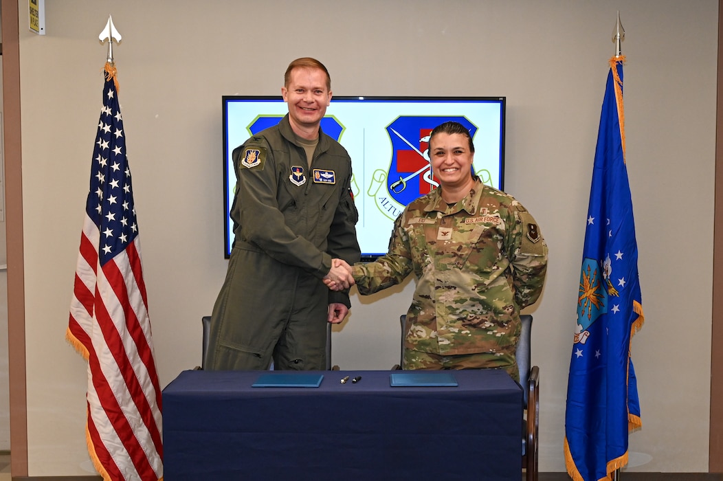 two people shake hands