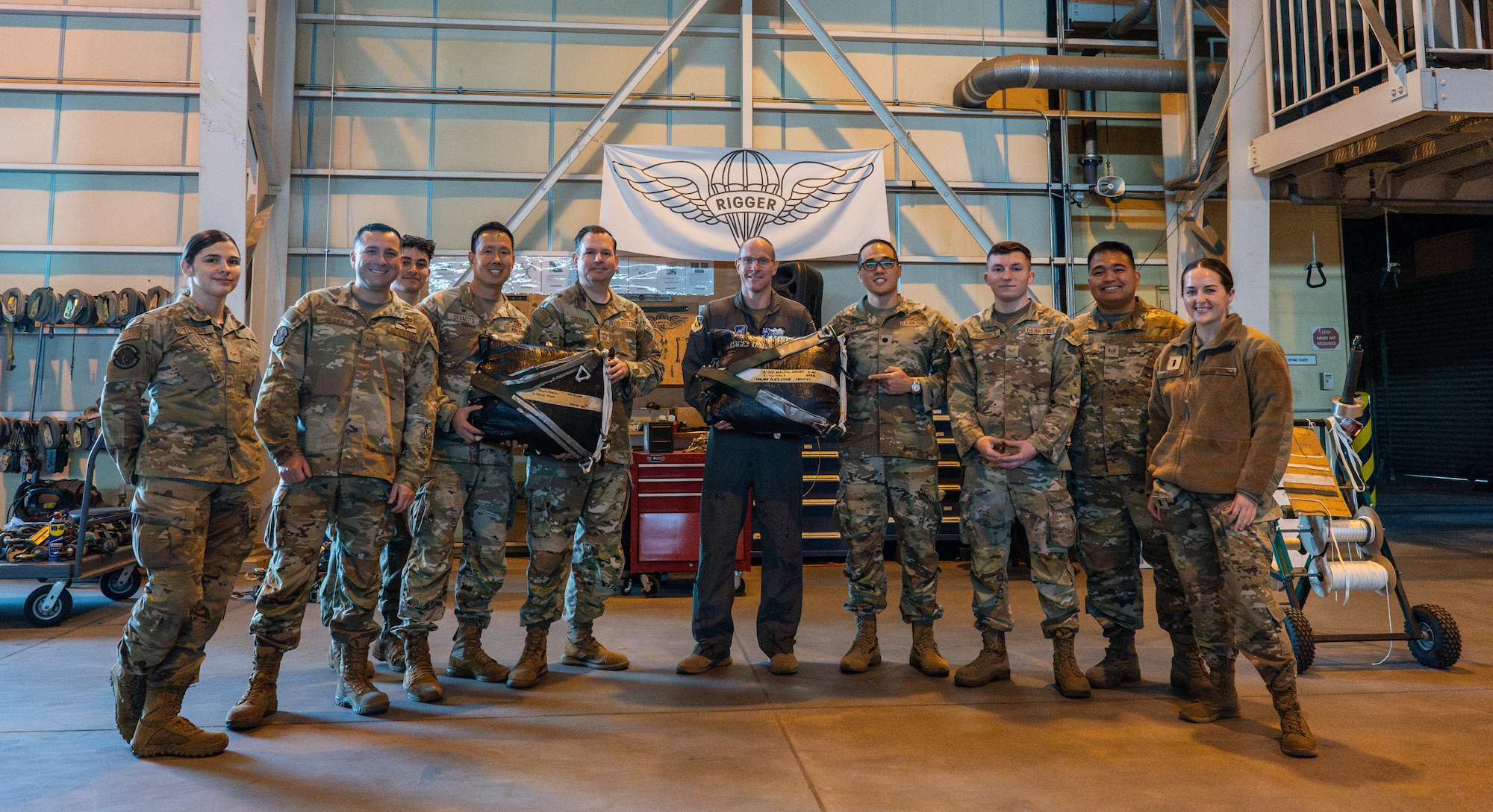 Members of the 374th Logistics Readiness Squadron combat mobility flight and 374th Airlift Wing leadership pose for a photo.