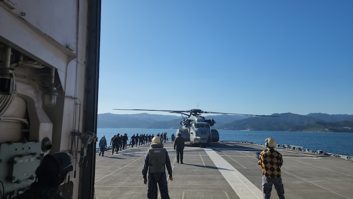 Explosive Ordnance Disposal Mobile Unit (EODMU) 5  Expeditionary Mine Countermeasures (ExMCM) Company 9-3 and Japan Maritime Self-Defense Force (JMSDF) EOD teams board an MH-53E Sea Dragon from Helicopter Mine countermeasures squadron 15 (HM-15) to conduct helicopter casting training during Mine Warfare Exercise (MINEX) 3JA near Aburatsu, Japan, Nov. 22, 2025.