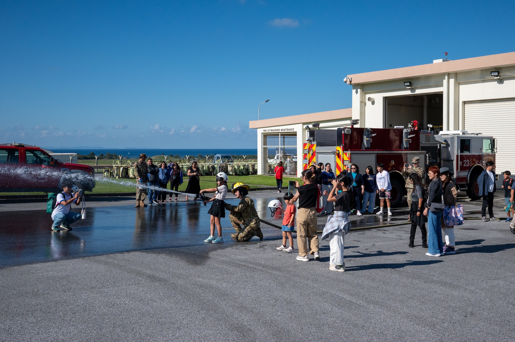 people stand in front of fire station