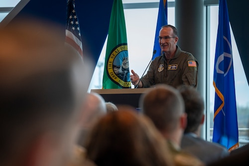 U.S. Air Force Lt. Gen. John Healy, chief of the Air Force Reserve and the commander of Air Force Reserve Command, speaks to Airmen, industry and mission partners during the KC-46A Tanker 100th Delivery Ceremony, Dec. 2, 2025, at the Everett Delivery Center in Everett, Washington. The KC-46A Pegasus is an aerial refueling aircraft capable of performing single and multi-point simultaneous aerial refueling. Designed for versatility and survivability, the aircraft can also support passenger and cargo movement, aeromedical evacuation, and features defensive, self-protection, and communication systems suited for contested environments. (U.S. Air Force photo by Staff Sgt. Dalton Williams)