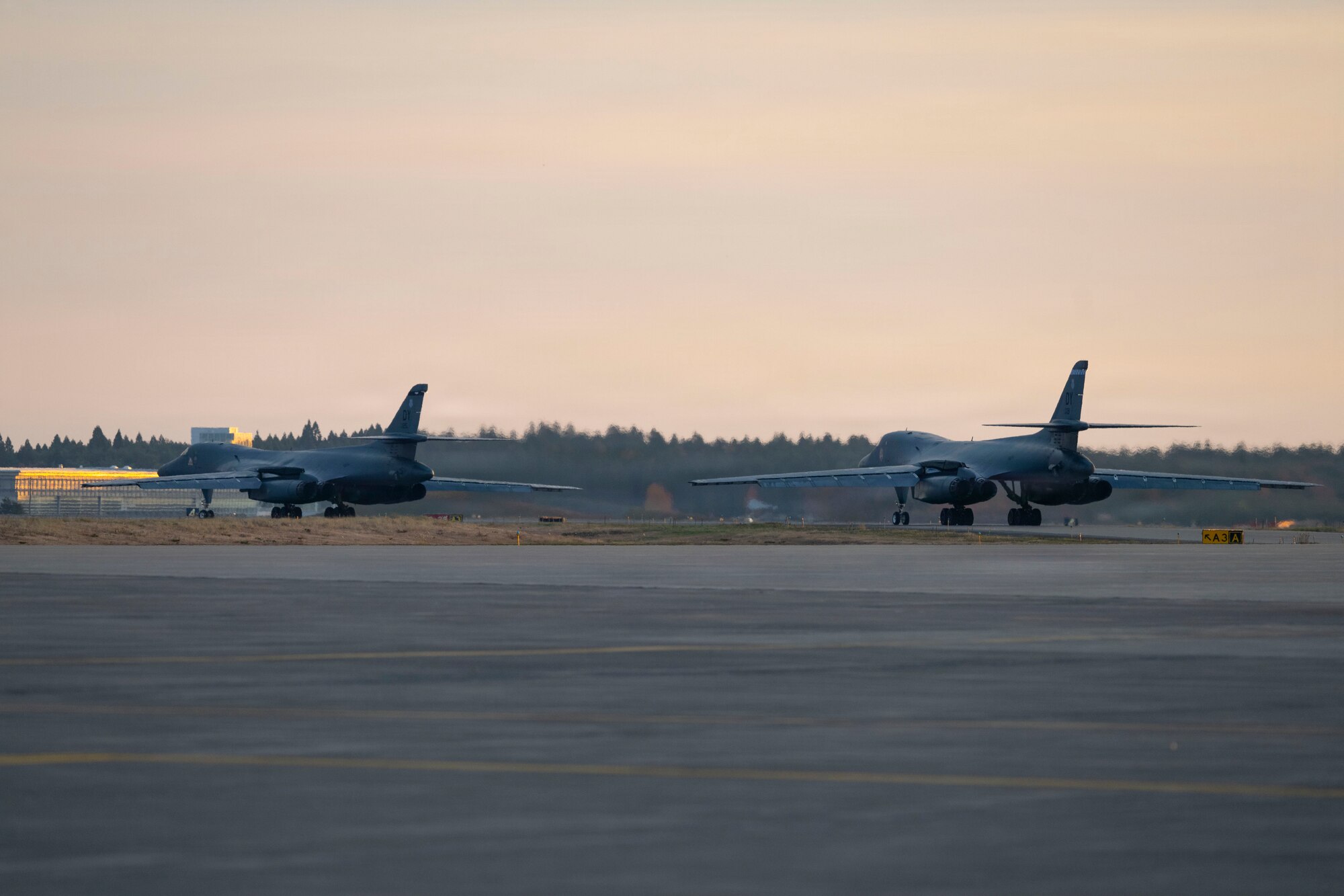 U.S. Air Force B-1B Lancers taxi for takeoff to return to Dyess Air Force Base, Texas, at Misawa Air Base, Japan, Nov. 17, 2025, concluding a bomber task force deployment. Bomber task force deployments support the shared vision of a secure, free and prosperous Indo-Pacific region. (U.S. Air Force photo by Senior Airman Emma Anderson)