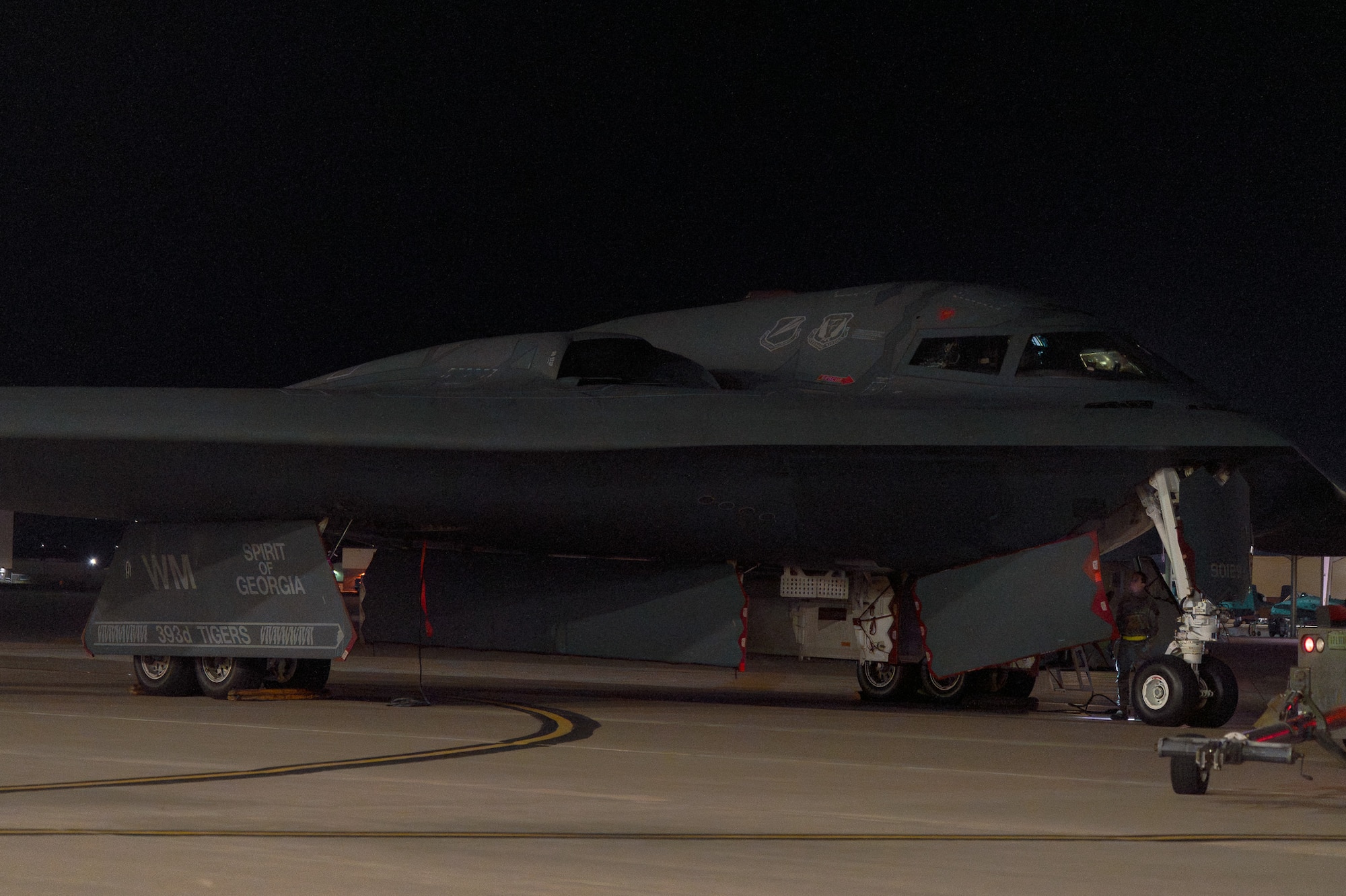 A U.S. Air Force B-2 Spirit, “Spirit of Georgia,” aircraft parks by a hangar at Whiteman Air Force Base, Missouri, Nov. 6th, 2025. The “Spirit of Georgia,” was damaged in an aircraft incident in September of 2021 and has recently returned to the fleet. (U.S. Air Force photo by Senior Airman Robert E. Hicks)