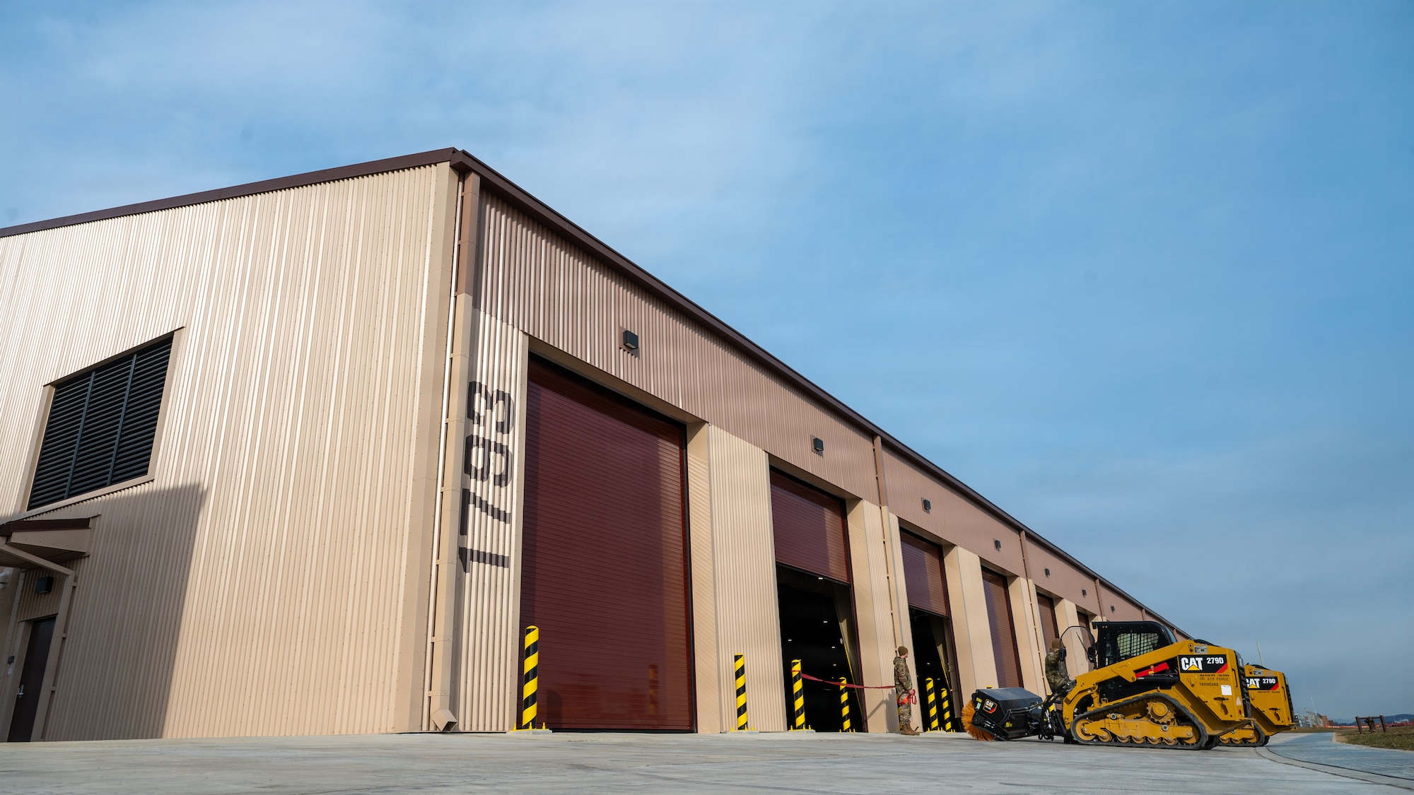 A newly constructed airfield damage recovery warehouse is ready for a ribbon-cutting ceremony before it begins official operations, at Osan Air Base, Republic of Korea, December 3, 2025. ADR facilities are needed to combat existing and future threats to the base by providing the capability to rapidly deploy repair teams within a minimum response time. (U.S. Air Force photo by Staff Sgt. Dustin Braaten)