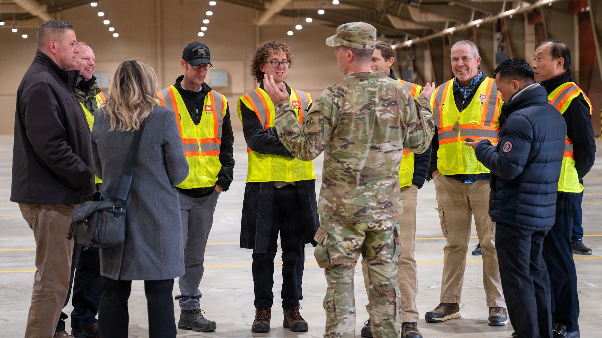 U.S. Army Col. Jeremiah Willis, U.S. Army Corps of Engineers-Far East District commander, speaks with team members inside of a newly constructed airfield damage recovery warehouse at Osan Air Base, Republic of Korea, December 3, 2025. Constructing the warehouse was a collaborative effort between USACE-FED, Republic of Korea Military National Defense-Defense Installations Agency, and the 51st Civil Engineer Squadron. (U.S. Air Force photo by Staff Sgt. Dustin Braaten)