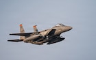 A U.S. Air Force F-15E Strike Eagle aircraft flies in the U.S. Central Command area of responsibility, Nov. 13, 2025. The F-15 was returning from the Marauder Shield 26.1 exercise, a key element of which was the sharpening of combined fighter capabilities between the U.S. and Kuwait Air Forces. This included joint training exercises and hot-pit refueling operations. Hot-pits, a form of grounded aircraft refueling while engines are hot, delivered speed to airpower by minimizing turnaround time, enabling U.S. and allied forces to maintain constant vigilance and project power where needed. (U.S. Air Force photo by Airman 1st Class Jonah Bliss)
