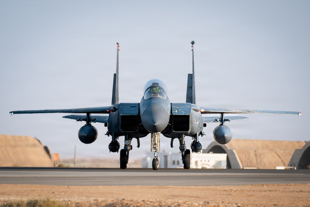 A U.S. Air Force F-15E Strike Eagle aircraft taxis to a hangar in the U.S. Central Command area of responsibility, Nov. 13, 2025. The F-15 was returning from the Marauder Shield 26.1 exercise which showcased the U.S. and Kuwait's commitment to air superiority through integrated Defensive Counter-Air operations. These operations demonstrated a unified front in protecting regional airspace and ensuring the safety and security of both nations. (U.S. Air Force photo by Airman 1st Class Jonah Bliss)