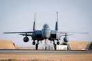 A U.S. Air Force F-15E Strike Eagle aircraft taxis to a hangar in the U.S. Central Command area of responsibility, Nov. 13, 2025. The F-15 was returning from the Marauder Shield 26.1 exercise which showcased the U.S. and Kuwait's commitment to air superiority through integrated Defensive Counter-Air operations. These operations demonstrated a unified front in protecting regional airspace and ensuring the safety and security of both nations. (U.S. Air Force photo by Airman 1st Class Jonah Bliss)