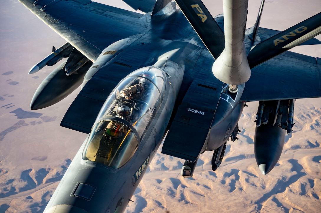 A U.S. Air Force F-15E Strike Eagle aircraft assigned to the 391st Expeditionary Fighter Squadron, approaches the boom of a KC-135T Stratotanker aircraft during an aerial refueling mission in the U.S. Central Command area of responsibility, Oct. 11, 2025. The Strike Eagle plays a key role in sustaining regional stability by supporting deterrence, defensive operations, and coalition airpower integration. (U.S. Air Force photo by Staff Sgt. Kristen Heller)