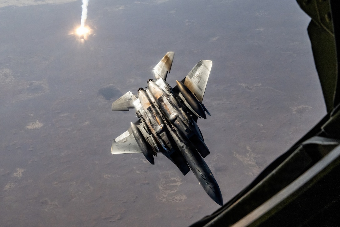 A U.S. Air Force F-15E Strike Eagle aircraft assigned to the 391st Expeditionary Fighter Squadron, deploys flares after completing an aerial refueling operation with a KC-135T Stratotanker aircraft in the U.S. Central Command area of responsibility, Oct. 11, 2025. The F-15E Strike Eagle’s ability to carry a wide variety of munitions allows it to conduct interdiction, close air support, and defensive counter-air missions within the CENTCOM AOR. (U.S. Air Force photo by Staff Sgt. Kristen Heller)