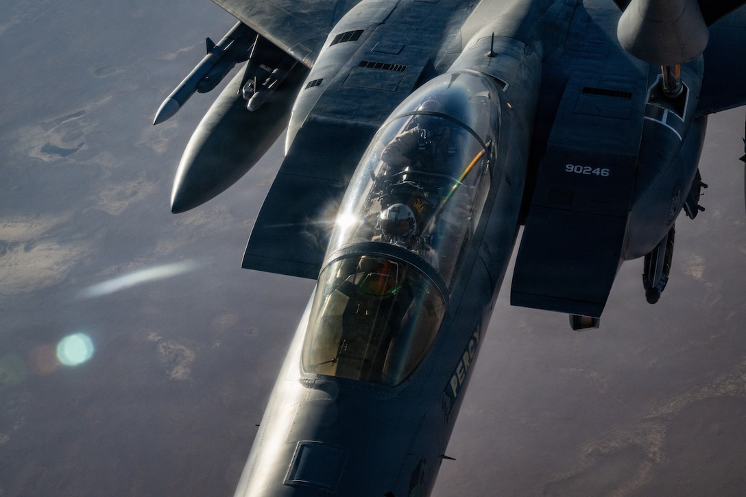 A U.S. Air Force F-15E Strike Eagle aircraft assigned to the 391st Expeditionary Fighter Squadron, receives fuel from a KC-135T Stratotanker aircraft assigned to the 32nd Expeditionary Air Refueling Squadron during a mission in the U.S. Central Command area of responsibility, Oct. 11, 2025. Aerial refueling extends the range and persistence of coalition aircraft supporting regional stability operations. (U.S. Air Force photo by Staff Sgt. Kristen Heller)