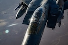 A U.S. Air Force F-15E Strike Eagle aircraft assigned to the 391st Expeditionary Fighter Squadron, receives fuel from a KC-135T Stratotanker aircraft assigned to the 32nd Expeditionary Air Refueling Squadron during a mission in the U.S. Central Command area of responsibility, Oct. 11, 2025. Aerial refueling extends the range and persistence of coalition aircraft supporting regional stability operations. (U.S. Air Force photo by Staff Sgt. Kristen Heller)