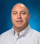 Terence Mahoney, Naval Surface Warfare Center Panama City Division infrastructure support engineer, is at the forefront of a crucial mission, directly bolstering the force behind the fleet in the complex littoral battlespace. His responsibilities are multifaceted: planning and designing complex construction and renovation projects, conducting site surveys, developing detailed cost estimations, and crafting comprehensive project specifications. (U.S. Navy photo by Eddie Green)