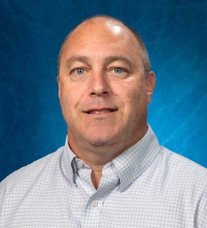 Terence Mahoney, Naval Surface Warfare Center Panama City Division infrastructure support engineer, is at the forefront of a crucial mission, directly bolstering the force behind the fleet in the complex littoral battlespace. His responsibilities are multifaceted: planning and designing complex construction and renovation projects, conducting site surveys, developing detailed cost estimations, and crafting comprehensive project specifications. (U.S. Navy photo by Eddie Green)