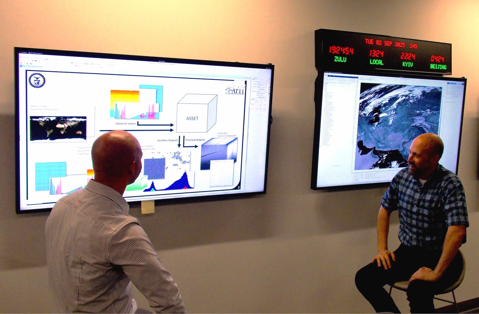 Caption: ASSET teams discuss simulated data at the SSC OPIR TAP Lab in Boulder, Colo. (Courtesy Photo)