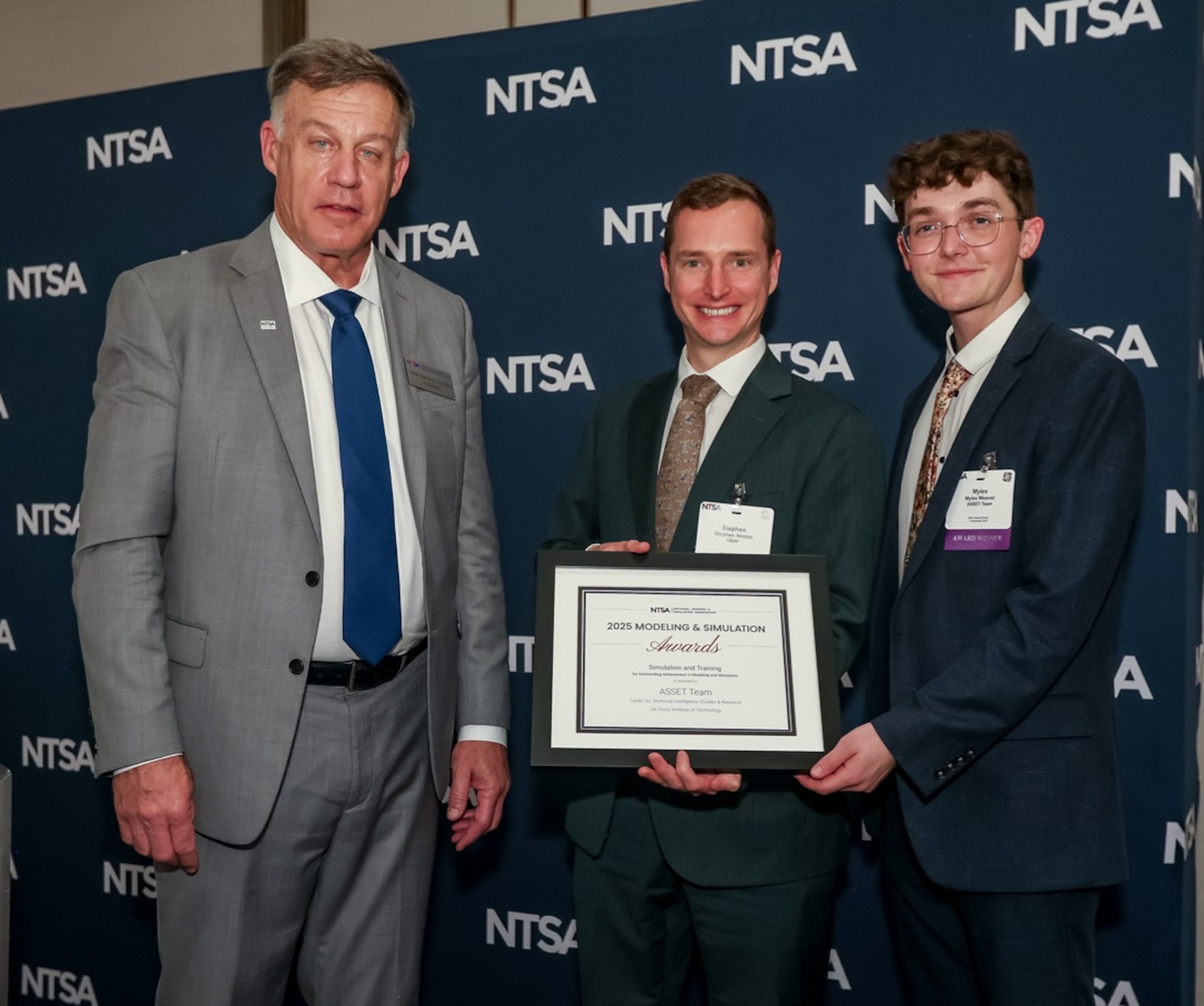 The ASSET team received this year’s Training and Simulation Team Award from the National Training & Simulation Association at the Interservice/Industry Training, Simulation and Education Conference on Dec. 2, 2025. Pictured are (Left) RADM Sean Buck, USN (Ret), President of NTSA (Middle) Stephen Hinton, ASSET team lead, (Right) Myles Weaver, ASSET developer. (Photo by EPNAC)