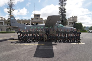 People stand with plane.