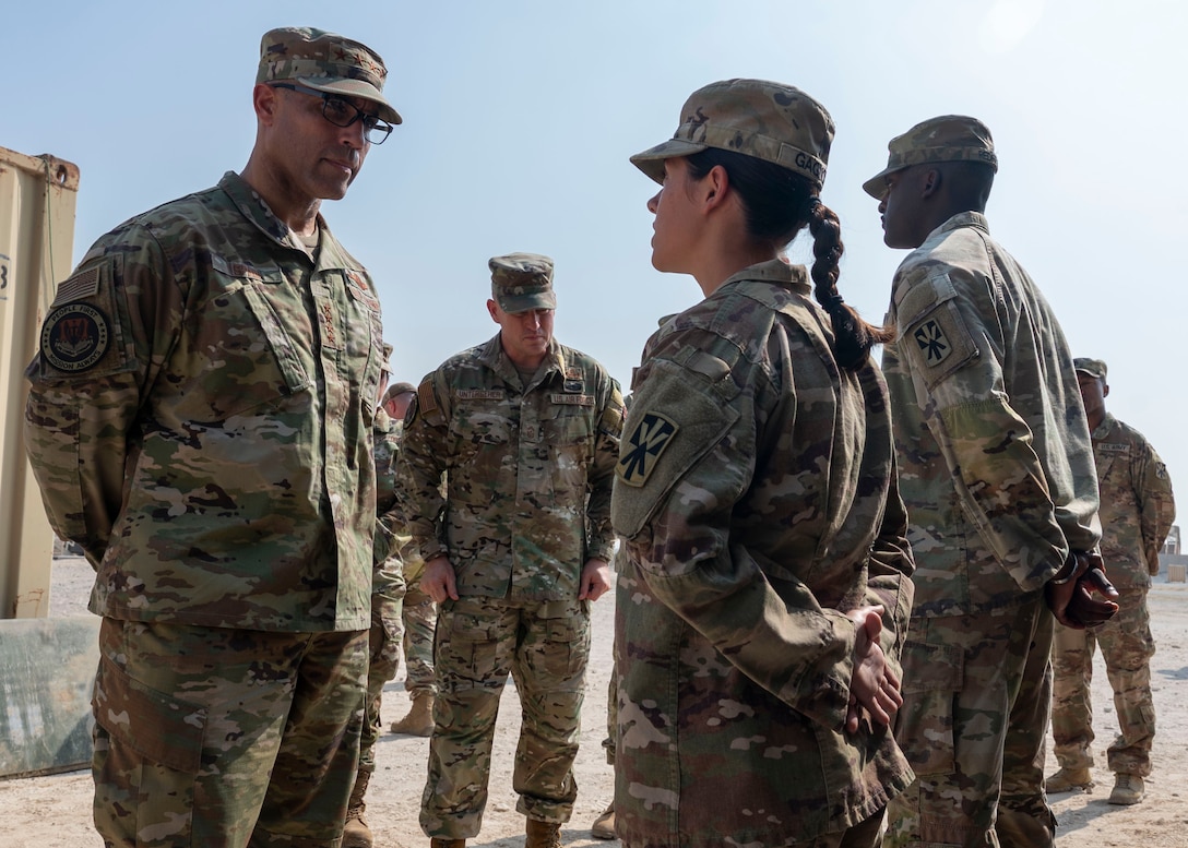 U.S. Air Force Gen. Adrian Spain, commander of Air Combat Command, speaks with U.S. Army SPC Marisa Gagnon, Charlie Battery, 2nd Battalion, 43rd Air Defense Artillery Regiment, 11th Air Defense Artillery Brigade, tactical control assistant, within the U.S. Central Command area of responsibility, Nov. 18, 2025. Spain toured the Patriot missile site where Gagnon worked and emphasized the importance of air and ground integration for regional defense. (U.S. Air Force photo by Senior Airman Paige Weldon)