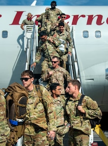 Joint Base Charleston Airmen deboard the plane upon returning from the Joint Pacific Multinational Readiness Center rotation 26-01 exercise.