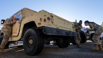 U.S. Army Soldiers assigned to the 1st Battalion, 204th Air Defense Artillery Regiment, Mississippi National Guard, instruct U.S. Air Force Airmen assigned to the 11th Civil Engineer Squadron on vehicle inspections at Fort Belvoir, Va., Oct. 16, 2025.
