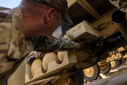 U.S. Air Force Chief Master Sgt. Justin S. Cruz, senior enlisted leader for the 11th Civil Engineer Squadron, inspects a medium tactical vehicle at Fort Belvoir, Va., Oct. 16, 2025.