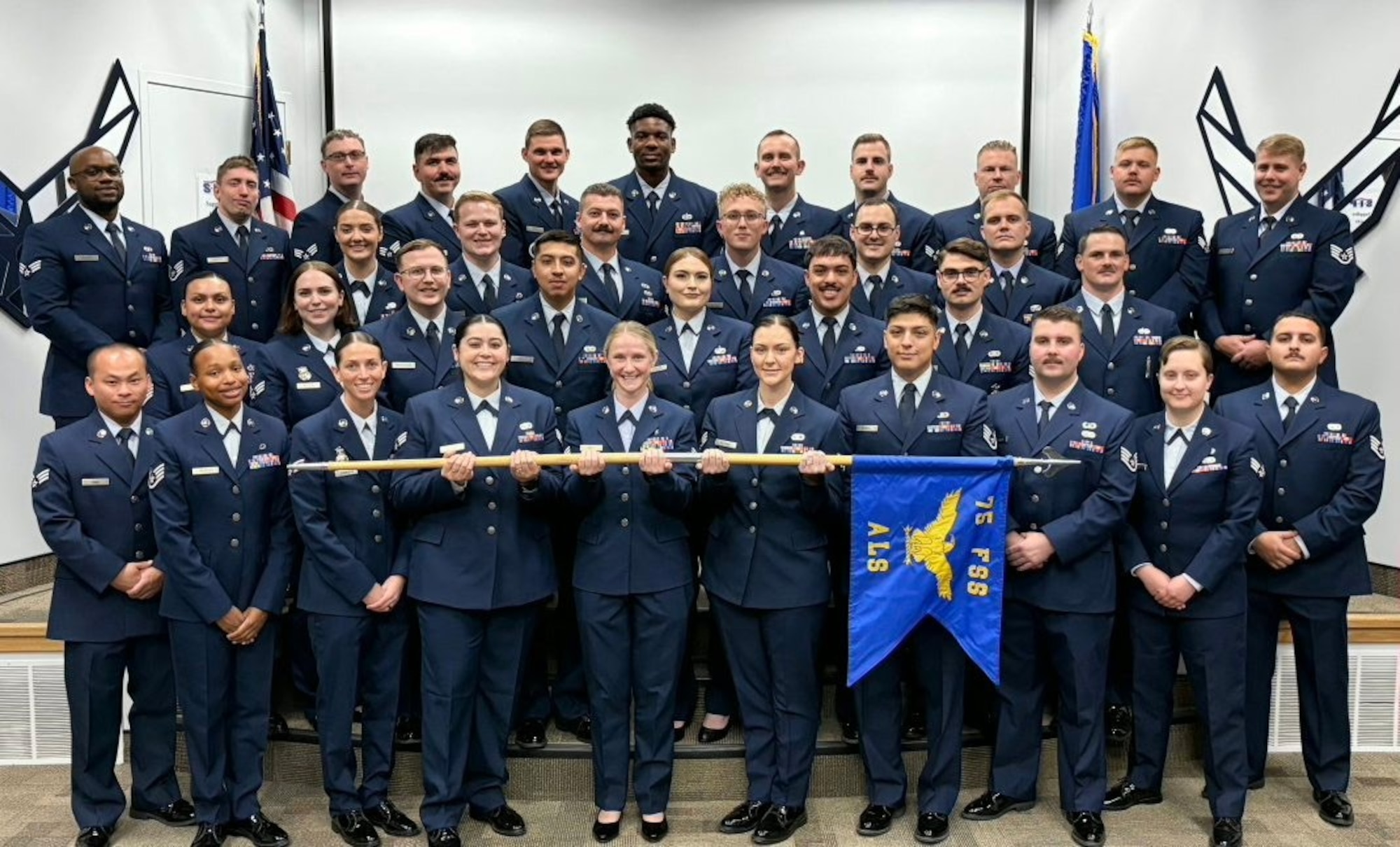 ALS Class 26-A pose for a photo.