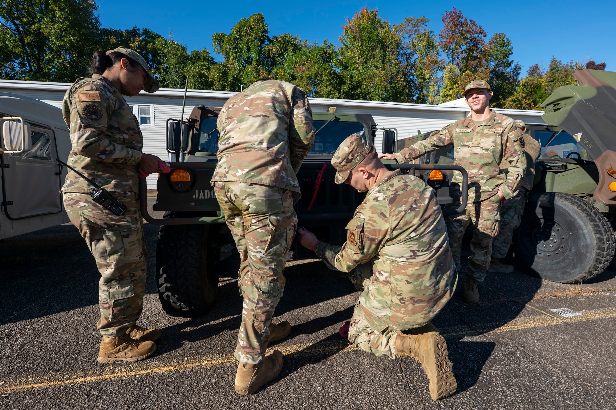 U.S. Air Force Airmen assigned to the 11th Civil Engineer Squadron perform a pre-convoy inspection on a Humvee at Fort Belvoir, Va., Oct. 16, 2025.
