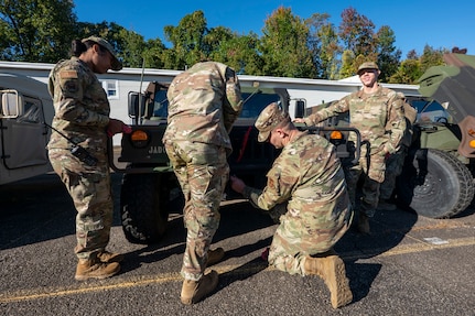 U.S. Air Force Airmen assigned to the 11th Civil Engineer Squadron perform a pre-convoy inspection on a Humvee at Fort Belvoir, Va., Oct. 16, 2025.