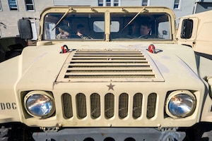 U.S. Air Force Airmen assigned to the 11th Civil Engineer Squadron conduct convoy training in a Humvee at Fort Belvoir, Va., Oct. 16, 2025.