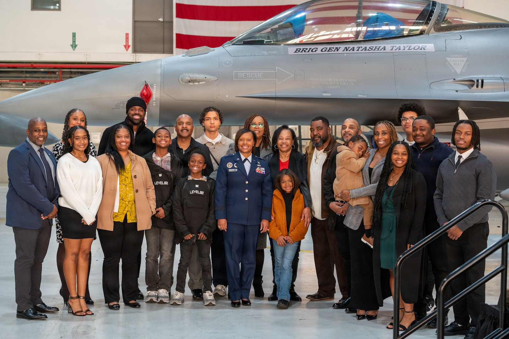 Family members of U.S. Air Force Brig. Gen. Natasha S. Taylor, director of the Joint Staff, Joint Force Headquarters, District of Columbia National Guard, pose for a group photos after a ceremony formally promoting her on Joint Base Andrews, Maryland, Dec. 3, 2025. In this role, she is responsible for overseeing and managing the development, execution, and evaluation of joint staff programs and policies pertaining to the command, control, and operation of joint functions within the District of Columbia Army and District of Columbia Air National Guard. She manages readiness of joint defense programs to include the Civil Support Team, Homeland Response Force, State Partnership Program, Counter Drug Task Force, and Defense Support to Civil Authorities. (U.S. Air National Guard photo by Tech. Sgt. Andrew Enriquez)