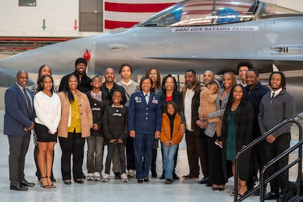 Family members of U.S. Air Force Brig. Gen. Natasha S. Taylor, director of the Joint Staff, Joint Force Headquarters, District of Columbia National Guard, pose for a group photos after a ceremony formally promoting her on Joint Base Andrews, Maryland, Dec. 3, 2025. In this role, she is responsible for overseeing and managing the development, execution, and evaluation of joint staff programs and policies pertaining to the command, control, and operation of joint functions within the District of Columbia Army and District of Columbia Air National Guard. She manages readiness of joint defense programs to include the Civil Support Team, Homeland Response Force, State Partnership Program, Counter Drug Task Force, and Defense Support to Civil Authorities. (U.S. Air National Guard photo by Tech. Sgt. Andrew Enriquez)