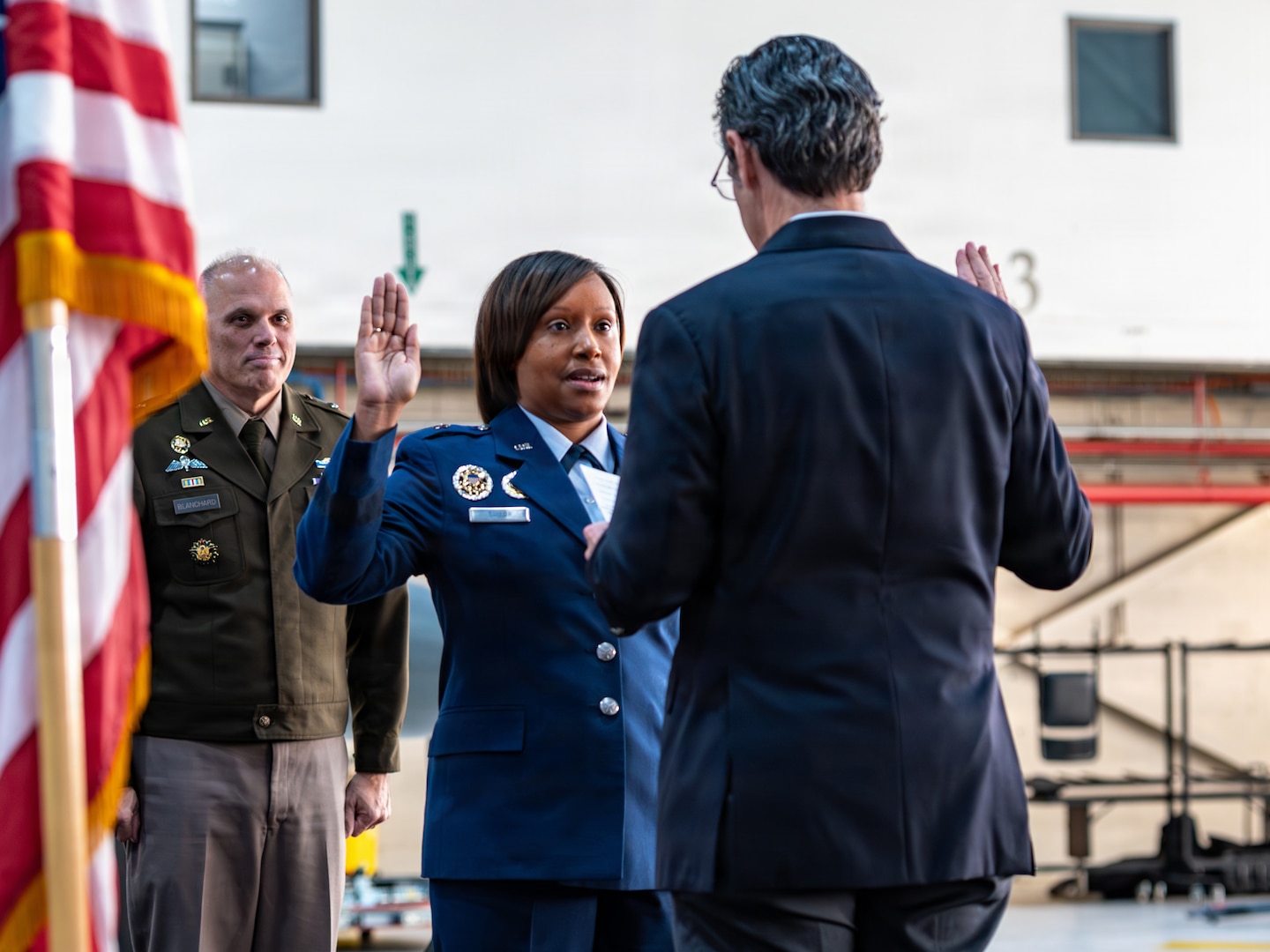 U.S. Air Force Lt. Gen. (Ret.) Marc H. Sasseville, right, administers the oath of office to Brig. Gen. Natasha S. Taylor, director of the Joint Staff, Joint Force Headquarters, on Joint Base Andrews, Maryland, Dec. 3, 2025, at a ceremony formally promoting Taylor to her rank. In this role, she is responsible for overseeing and managing the development, execution, and evaluation of joint staff programs and policies pertaining to the command, control, and operation of joint functions within the District of Columbia Army and District of Columbia Air National Guard. She manages readiness of joint defense programs to include the Civil Support Team, Homeland Response Force, State Partnership Program, Counter Drug Task Force, and Defense Support to Civil Authorities. (U.S. Air National Guard photo by Tech. Sgt. Andrew Enriquez)